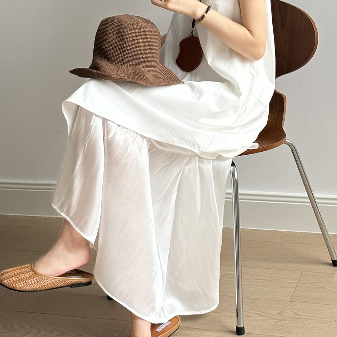 Sleeveless Long Dress with Asymmetrical Hem and Panelled Design