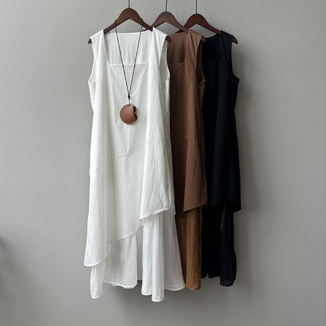 Sleeveless Long Dress with Asymmetrical Hem and Panelled Design