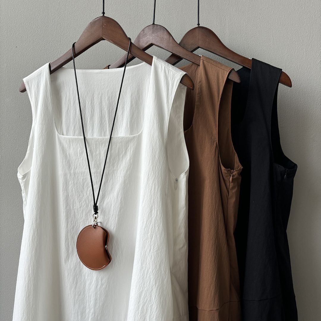 Sleeveless Long Dress with Asymmetrical Hem and Panelled Design