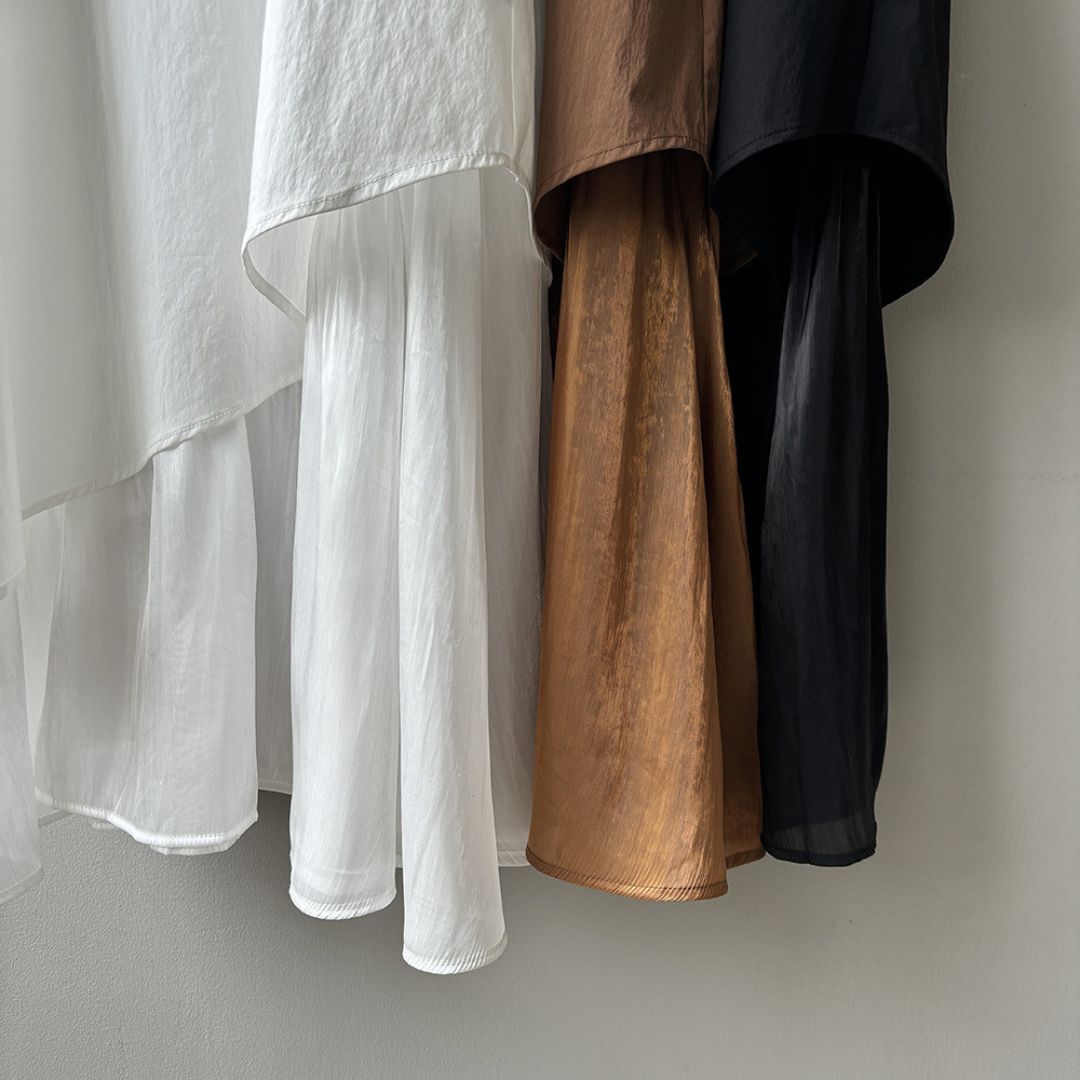 Sleeveless Long Dress with Asymmetrical Hem and Panelled Design
