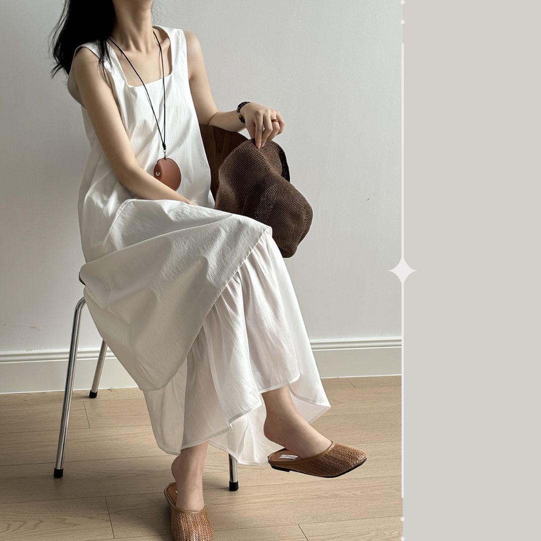 Sleeveless Long Dress with Asymmetrical Hem and Panelled Design