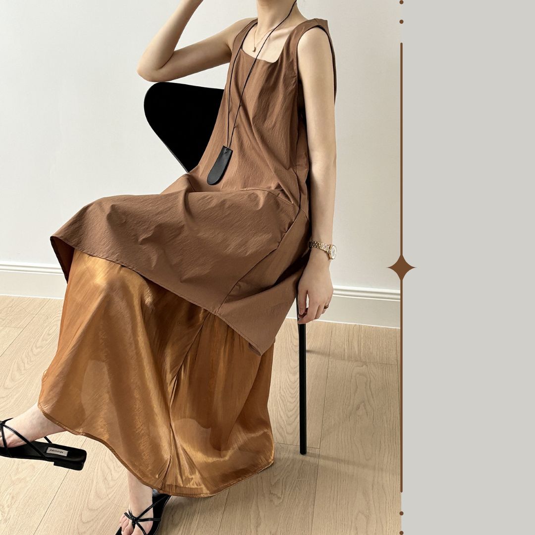 Sleeveless Long Dress with Asymmetrical Hem and Panelled Design